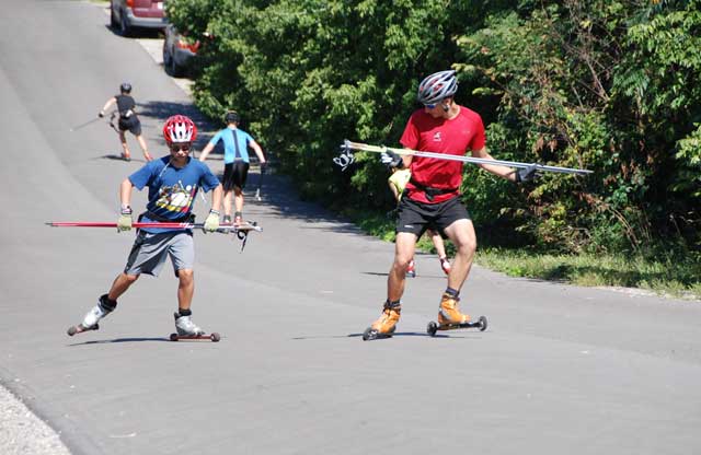 NDC member Dudley Coulter (r) helping a younger skier with technique photo credit Graham Longford